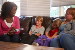 care manager talking to client and her kids