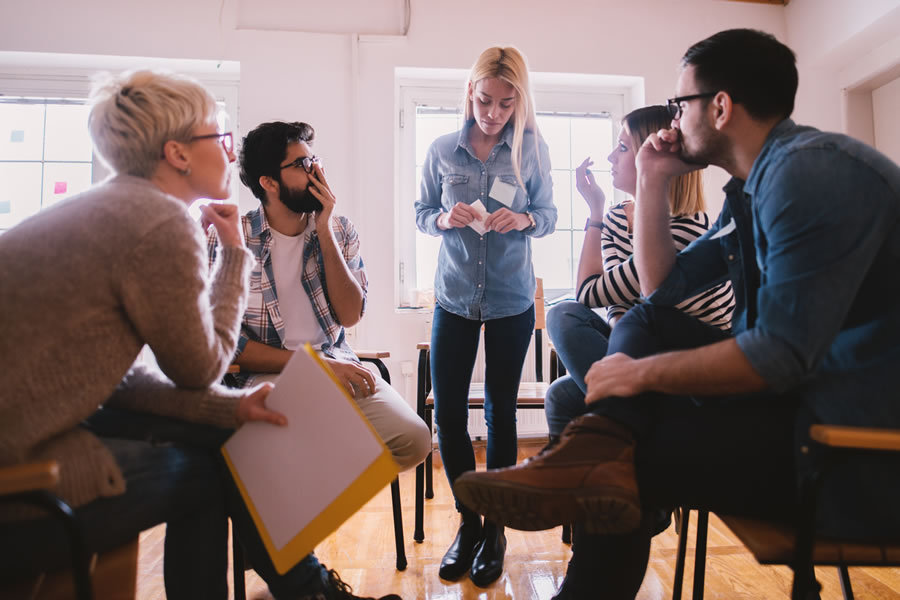 group of people in counselling session