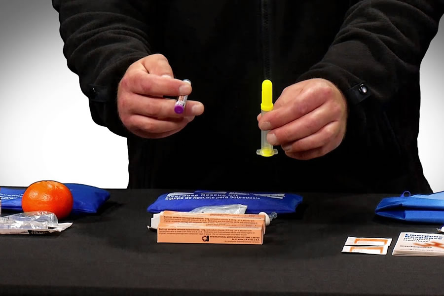 person demonstrating narcan use