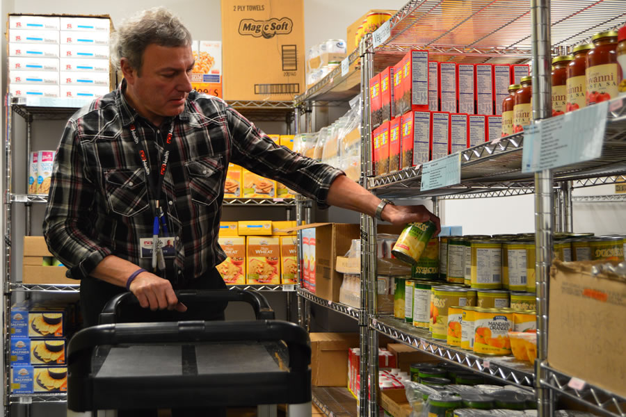 man stocking shelves