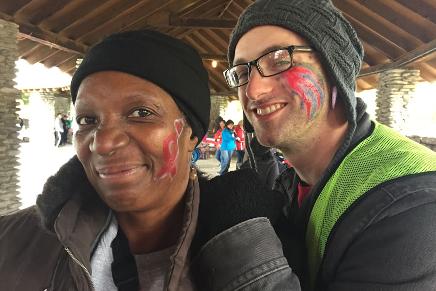 two smiling people with faces painted