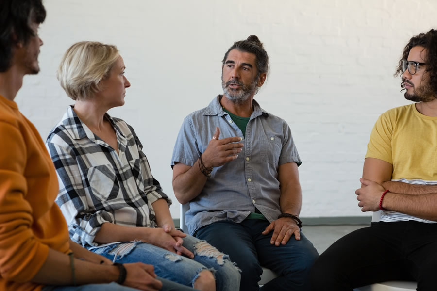 man talking to a group of people