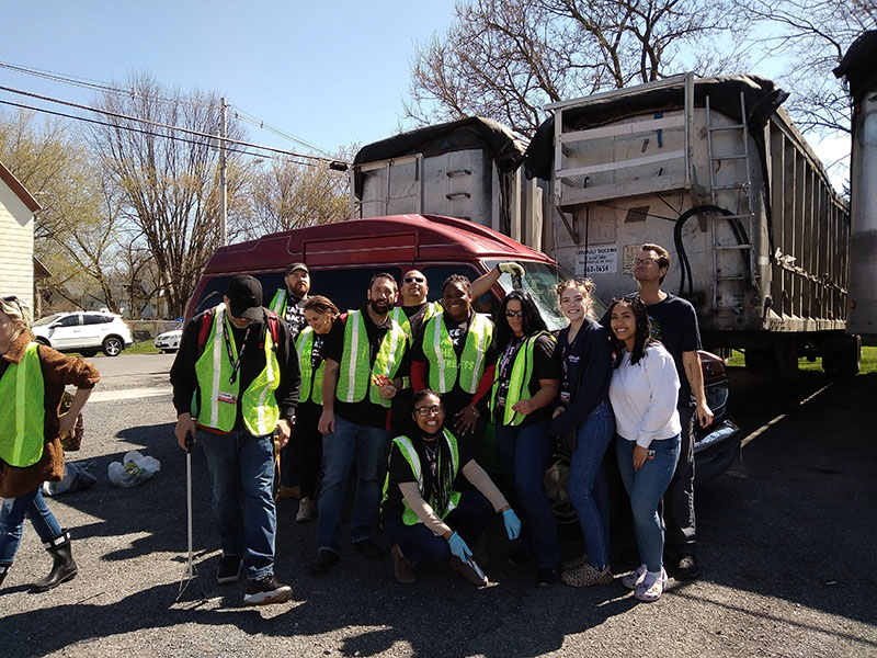 group of people in vests